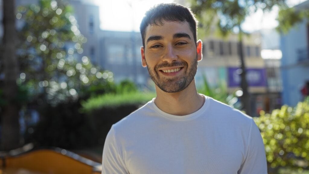 Young man smiling after attending anaheim drug rehab.
